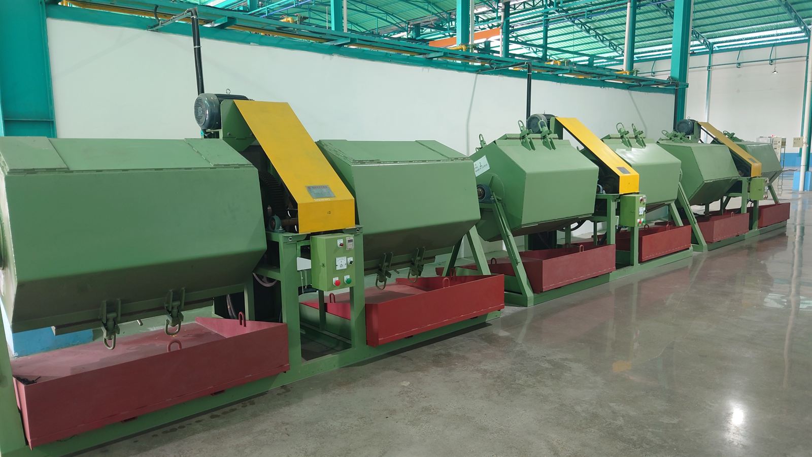 Barrel tumbling machines at the SHEDA factory